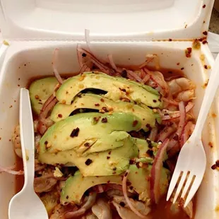 a fork and spoon in a container