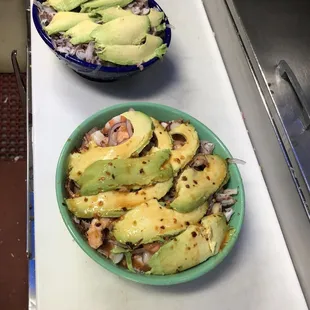 a bowl of avocados and a bowl of rice