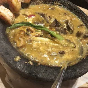 Molcajete with carne asada, pollo and shrimp