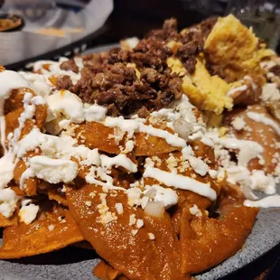 Chilaquiles flight with your 3 choices of sauce, meat and eggs.