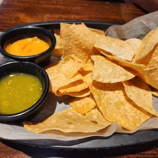 Chips and green salsa Verde with another type of dip if you will, has peanut in it different, but tasty! Salsa and Chips Salsa and Chips