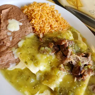 Enchiladas (cheese) Suisse with tomatillo sauce and carnitas. Delicious.