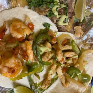 Shrimp, chicken fajita, and carnita taco