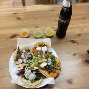 Tacos Al pastor, steak, carnitas and chicken, Mexican Coke