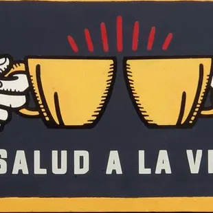 two hands holding beer glasses