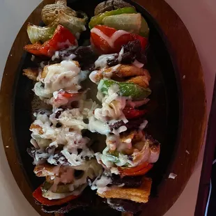 Alambres Combo- chicken, steak, green peppers, mushrooms, onion, shrimp, and white queso