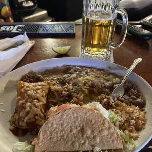 Cold Ground Beef Enchilada, (soggy) crunchy taco, cold unseasoned beans and rice.