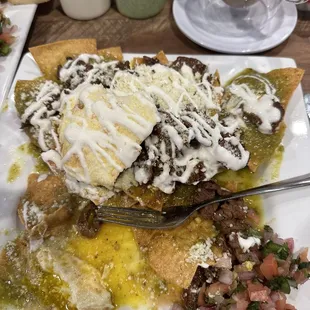 Chilaquiles Verde with steak, pico
