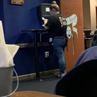 Waitress on her phone avoiding us.
