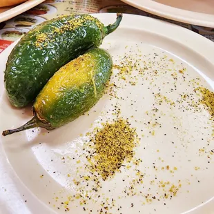 two chili peppers on a plate