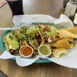 Fish, shrimp, carnitas, and al pastor tacos.