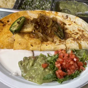 quesadilla, salsa, and guacamole on a plate