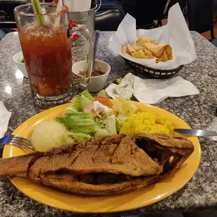 Black bass with garlic sauce.