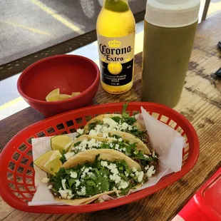 3 ground beef tacos add cheese, green sauce and a corona.. Perfection!