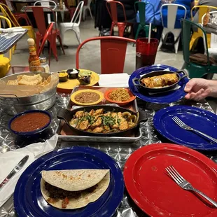 Beef taco (plain), beef enchilada, chicken fajitas with charro beans and green chile rice