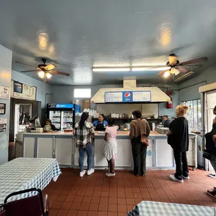 Inside restaurant, place order and get food at once.