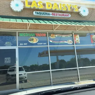 Storefront.  It says "Mexican Tacos All Day Every Day".  'Cept they are closed on Sunday, so "Almost Every Day"