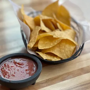 a bowl of chips and a bowl of ketchup