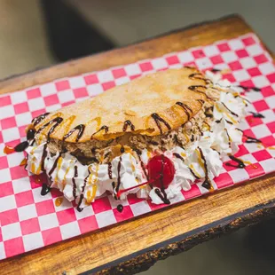  desert with whipped cream and chocolate