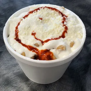 Elotes - $5. Large.  Cheese, sour cream, corn from the can.