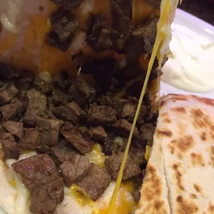 Steak Quesadilla. You add the Pico , S Cream if you like, some fresh salsa, and boom the best $4.50 you will ever spend!