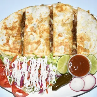 quesadillas and vegetables on a plate