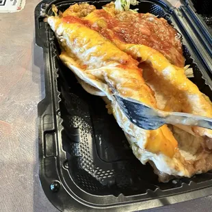 There so-called smothered burritos. What you see in the top right corner is not green chili, it&apos;s beans out of another burrito.