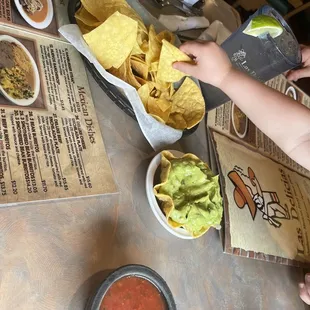 Big crunchy chips, and our 2 year old cried at the spicy salsa. So we got him an order of guacamole.