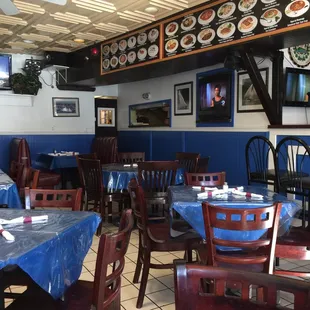 tables and chairs with blue tablecloths