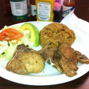 Chuletas (Pork Chops) con Morro de Habichuela (Yello Rice and Peas).