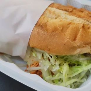a sandwich in a styrofoam container