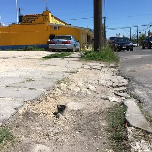Tire damaging object, left parking lot entrance.