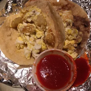 Delicious breakfast tacos!!! Potato &amp; egg on corn, Bean &amp; egg on flour tortilla. Spicy authentic hot sauce. Mexican homemade!!! A+