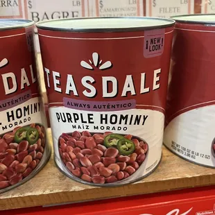 three cans of beans on a shelf
