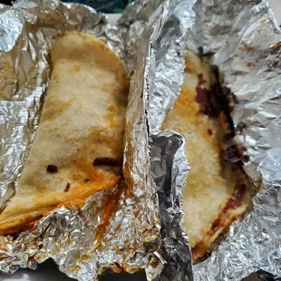 two quesadillas wrapped in foil