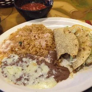Taco dinner. Yes I poured cheese dip on the rice to make it better. Life is short ok.