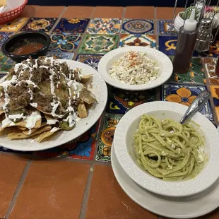 nachos w/ barbacoa, elote and spaghetti