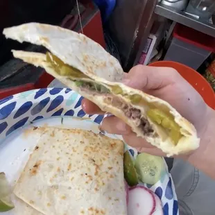 a person holding a plate of food