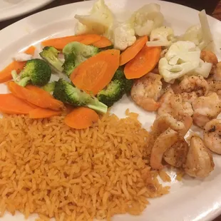 Grilled shrimp, steamed vegetables, and rice for $8.75. Really tasty.