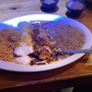 Chicken enchilada, tamale, rice, beans
