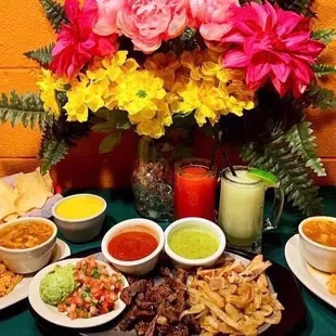 a variety of mexican food on a table