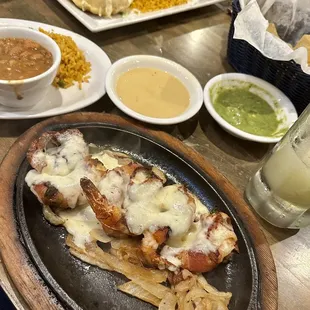 Sizzling Shrimp Amarrados and Stuffed Avocado Platter in the background