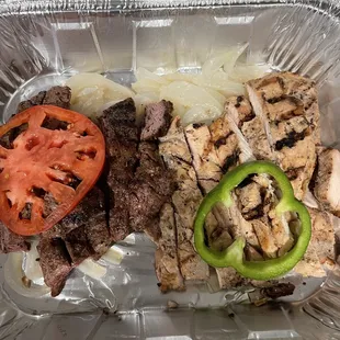 House fajitas for two. Note the raw pepper and tomato placed on top.