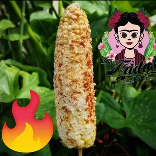 a close up of a corn on a stick