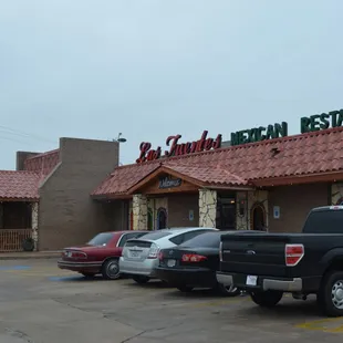 cars parked in front of a mexican restaurant
