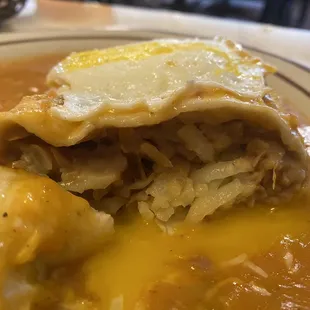 Topped burrito full of delicious beans and perfectly seasoned hash browns