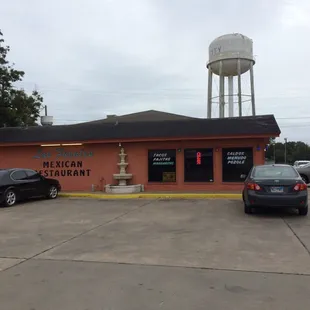 cars parked in front of the restaurant