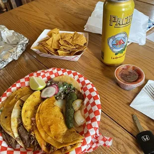 Birria, conchinita and lengua tacos, chips and salsa. No beer sold at the truck ;)