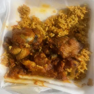 Jollof rice and turkey, plantain not included but says it should come with the meal.