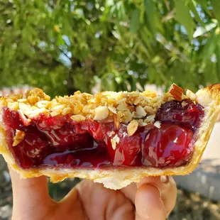 a hand holding a pastry